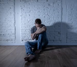 Person struggling with feelings of contamination, trauma therapy San Diego