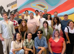 Group photo at a San Diego improv studio showing community and social connection