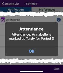 School app notification showing student marked tardy, representing digital gradebooks and real-time parental monitoring of academic performance.